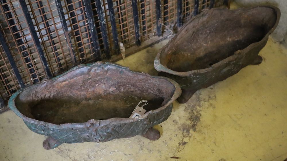 A pair of late 19th century French cast iron oval urns, width 49cm